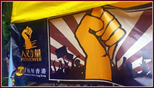 “Power to the People: Persist for a Better Hong Kong”    Photo by Mai Perkins during the July 1st March in Hong Kong.